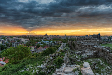sunset over Plovdiv city, Bulgaria. Panoramic view from one of the hills - Nebet tepe with walls...