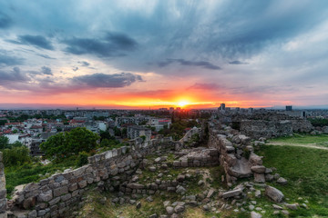 sunset over Plovdiv city, Bulgaria. Panoramic view from one of the hills - Nebet tepe with walls...