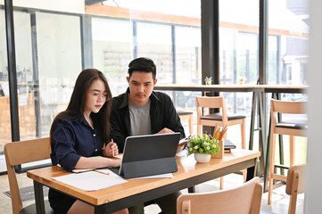Cropped shot meeting a startup business women and man working in co working space.