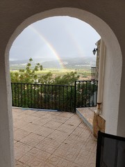 Rainbow through the arch