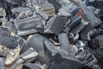 Smoldering woody coal