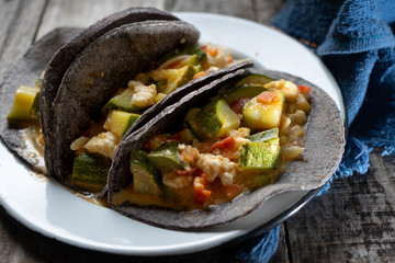 Mexican zucchini stew  tacos with blue tortilla