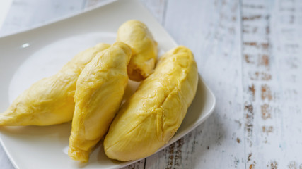 The king of fruit from Thailand, Durian in white dish with wood background.