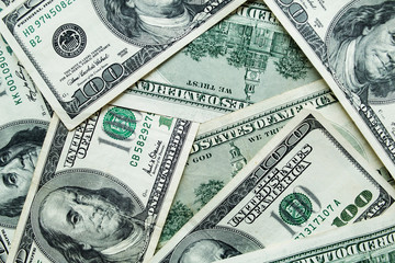 Background full of 100 us dollars. Business and finance.