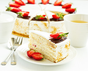 Sponge cake with strawberries and cream. Selective focus.