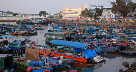 Crowded of small boat in the sea of Cheung chau island in the evening