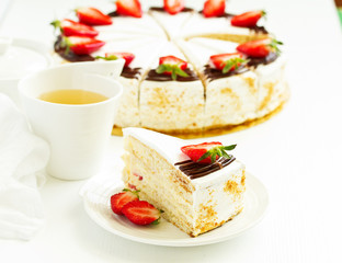 Sponge cake with strawberries and cream. Selective focus.