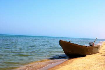 Fishing boat on the sand beach.  Old boat on beach. 