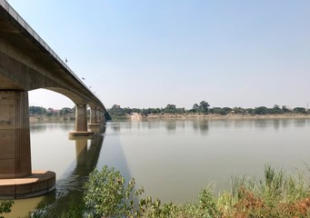 Fototapeta na wymiar Bridge over the Mekong Thai-Laos friendship bridge