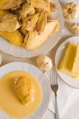 Caucasian cuisine. Circassian (Adyghe) traditional folk dish. Boiled chicken with sour cream sauce (djedlibje) Served with pasta (millet dish)