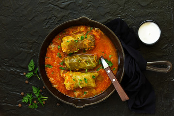 Ukrainian traditional dish with cabbage and stuffed cabbage. Selective focus.