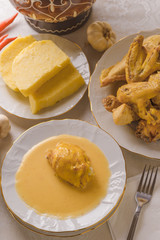 Caucasian cuisine. Circassian (Adyghe) traditional folk dish. Boiled chicken with sour cream sauce (djedlibje) Served with pasta (millet dish)