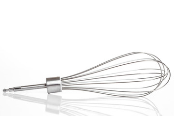 A Whisk metal whisk for a blender cream beating, an object on a white background with Copy Space for text.
