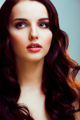 Fototapeta premium young pretty brunette woman with hairstyle waves, luxury look fashion makeup close up