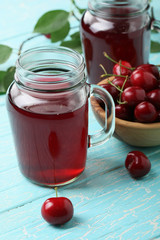 cherry compote in a glass jar with a handle