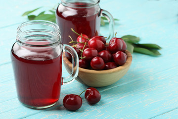cherry compote in a glass jar with a handle