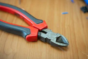 electrical tools lying on a table, close up, blurred background