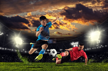 Obraz na płótnie Canvas Asian soccer player in action