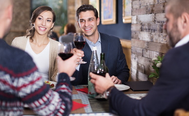 Company men and women in the restaurant