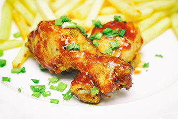 Chicken legs with french fries potatoes