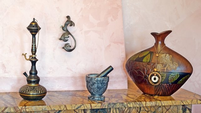 pounder, hookan and vase in interior