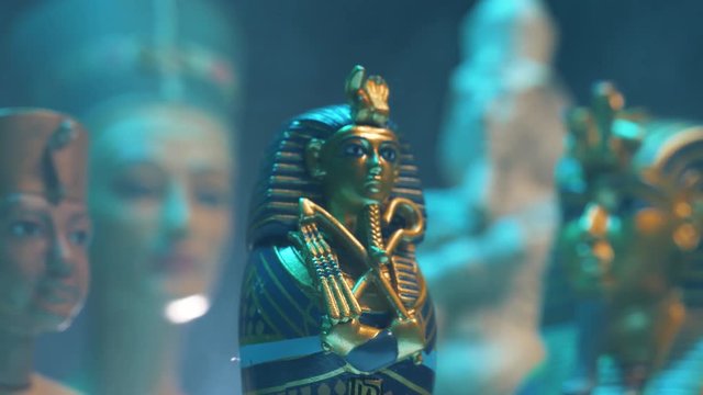 Dramatic shot of a pharaoh figure appearing in smoke.