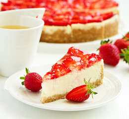 Classic cheesecake with fresh strawberries. Selective focus.
