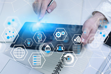 Man using tablet at table, digital interface