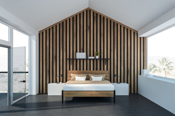 White attic master bedroom with balcony