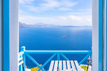 Balcony with a view of vast caldera filled with water in Oia. Santorini, Greece.