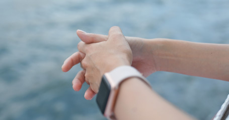 Woman cross finger with the background of the sea