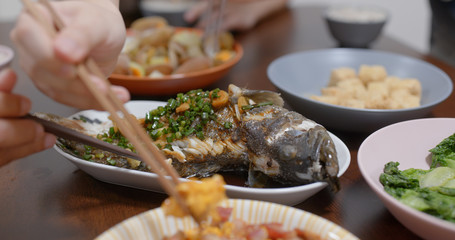 Home cooking with steamed fish, fry egg of pork and fry of clam