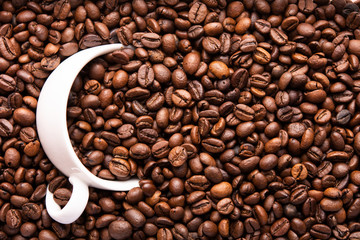 white cup of coffee beans top view