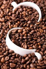two white cup of coffee beans top view