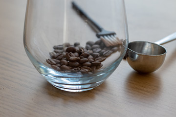 coffee beans in a transparent cup