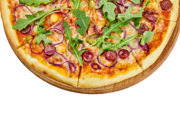 Delicious pizza with sausages mozzarella sauce cucumber and onions on a wooden board on an isolated white background