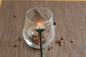 coffee beans in a glass with a sweep