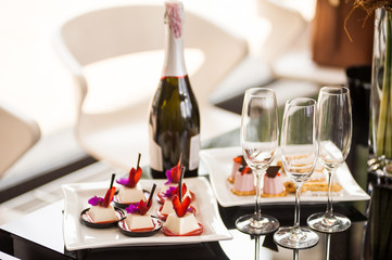 Champagne and desserts on the table, festive table.