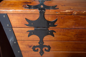black metal handmade hinge on wooden chest