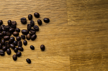 Coffee beans on a wooden background