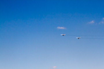 Military aircraft against the blue sky. Sunny day. Aircraft. Fighters