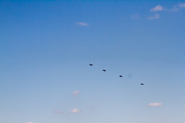 Military aircraft against the blue sky. Sunny day. Aircraft. Fighters