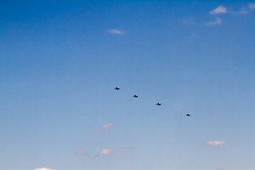 Military aircraft against the blue sky. Sunny day. Aircraft. Fighters