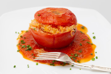 Stuffed tomato garnish and fork
