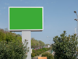 Empty green advertising billboard