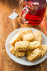 Sweet biscuits dessert and red fruity tea.