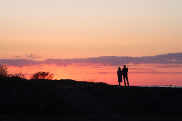 Fototapeta premium silhouette of photographer at sunset