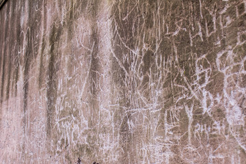 Written and scratched ancient walls near the ruins of the Roman Forum in the center of Rome, Italy. Abstract pattern.