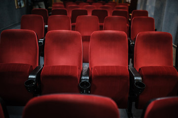 close up photo of rows of red seats in the cinema/theatre/concert hallcinema
