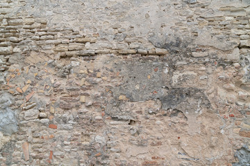 Obraz na płótnie Canvas Old stone Damaged Wall texture background